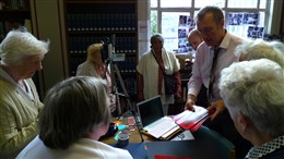 Photo:Education Officer, Peter Daniel and WCRAG group share memories of the Blitz at Westminster Reference Library